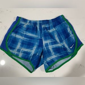 Blue Nike running shorts